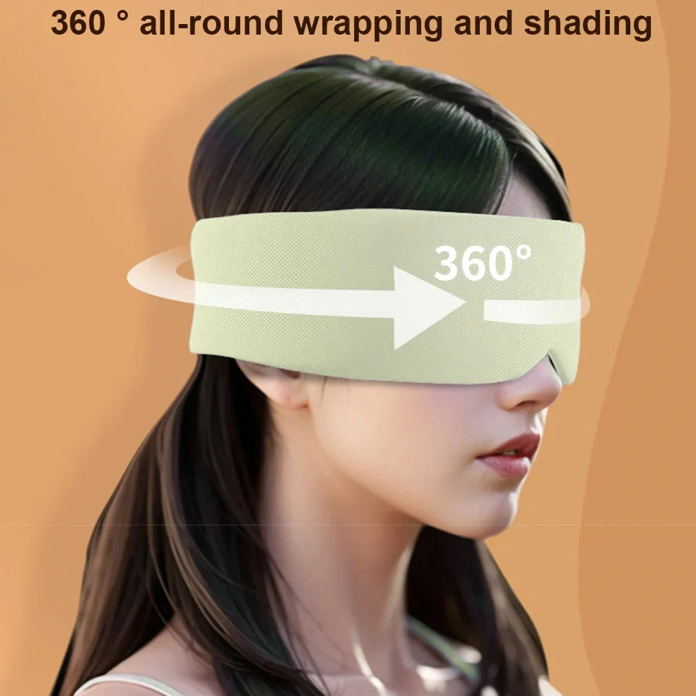 Gray double-sided sleep mask showing cool ice silk side and warm cotton side with adjustable magic tape closure