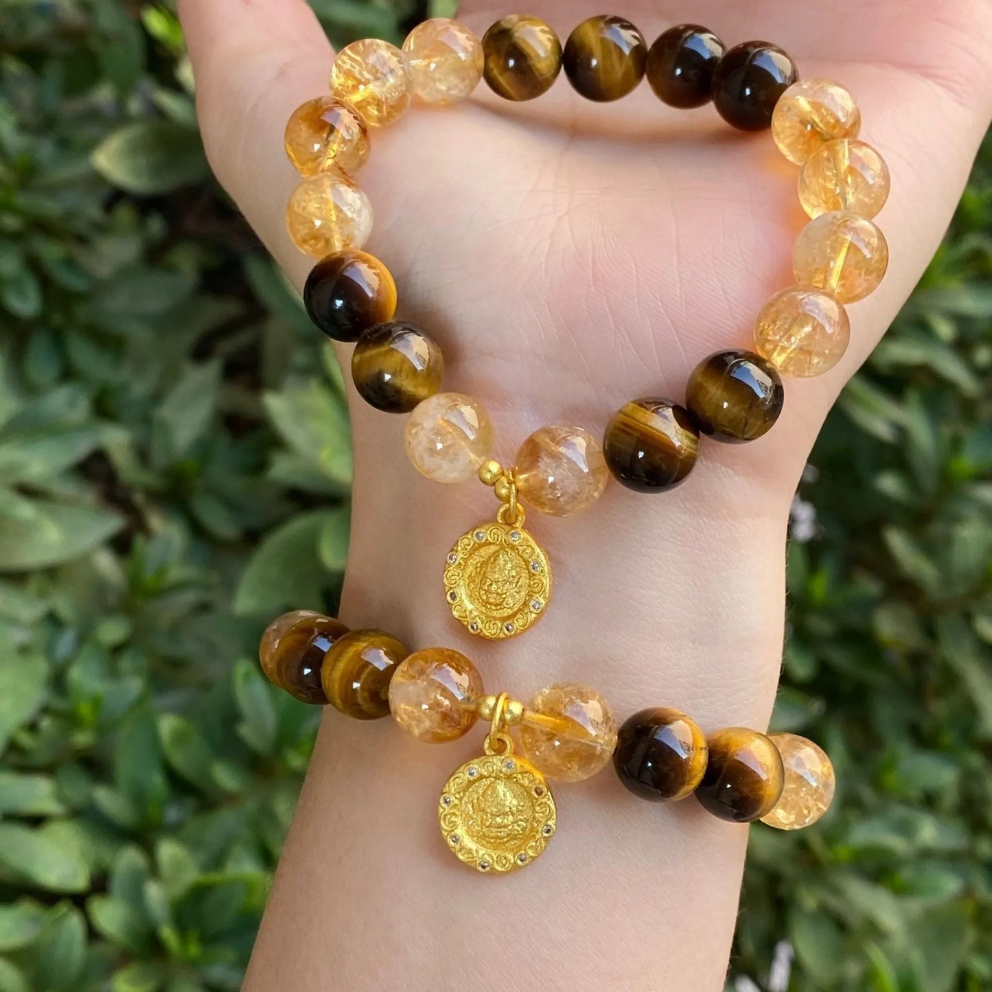 Handmade crystal bracelet with diamond gourd, disc, and prayer wheel beads in 8mm and 10mm sizes.