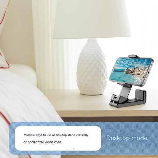 Black foldable rotating phone holder stand on a desk, showing universal phone compatibility and adjustable angles