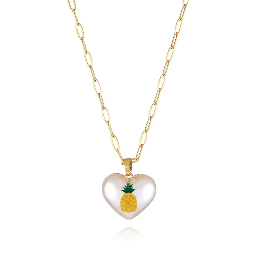 Geometric heart-shaped fruit pendant necklace on an adjustable metal chain