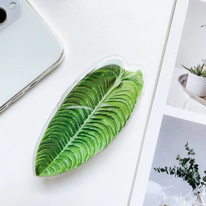 Stylish leaf-inspired smartphone stand with secure grip and adjustable viewing angle for hands-free use