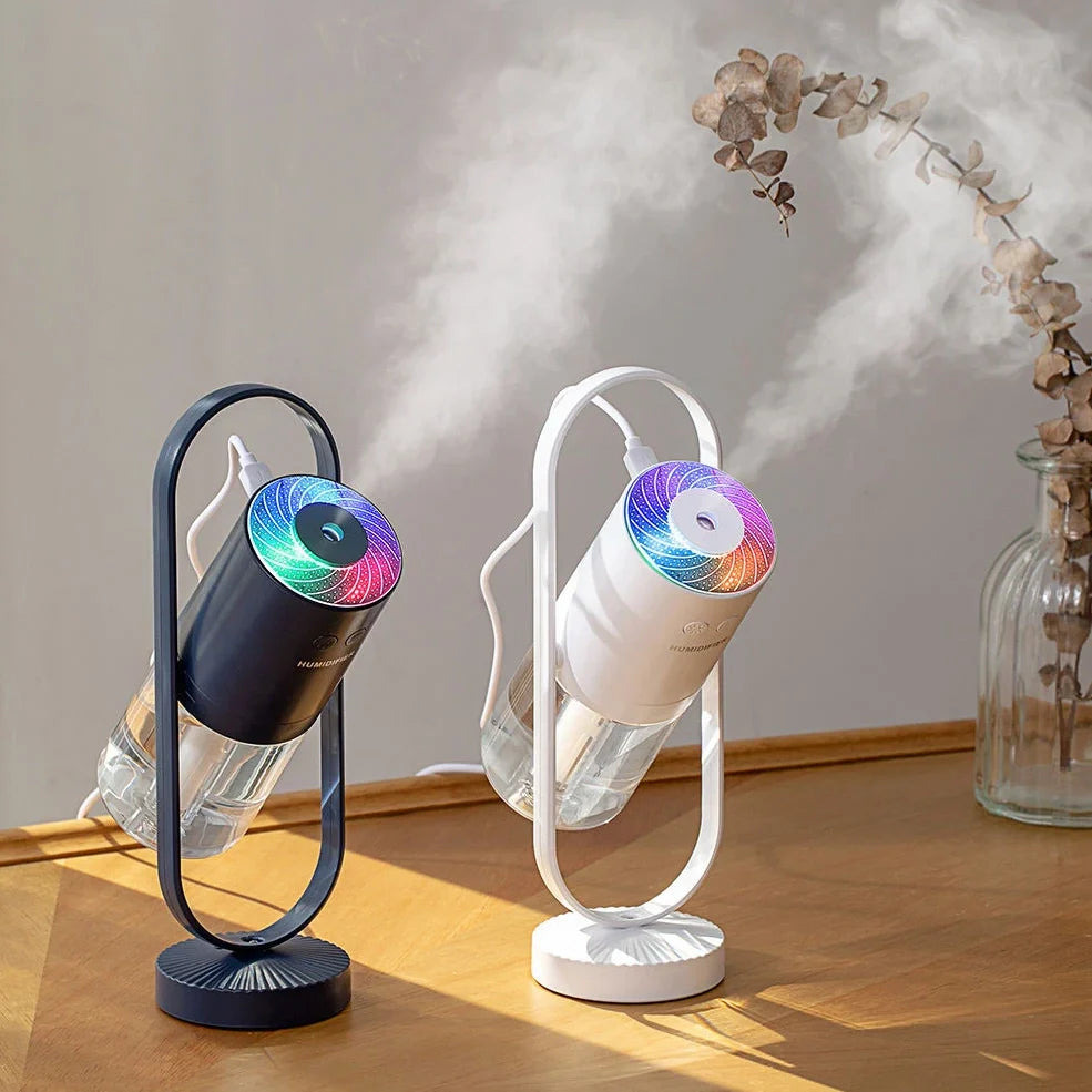 Portable USB humidifier with 200ml water tank in pink, blue, or white showing compact 70x66x213mm dimensions