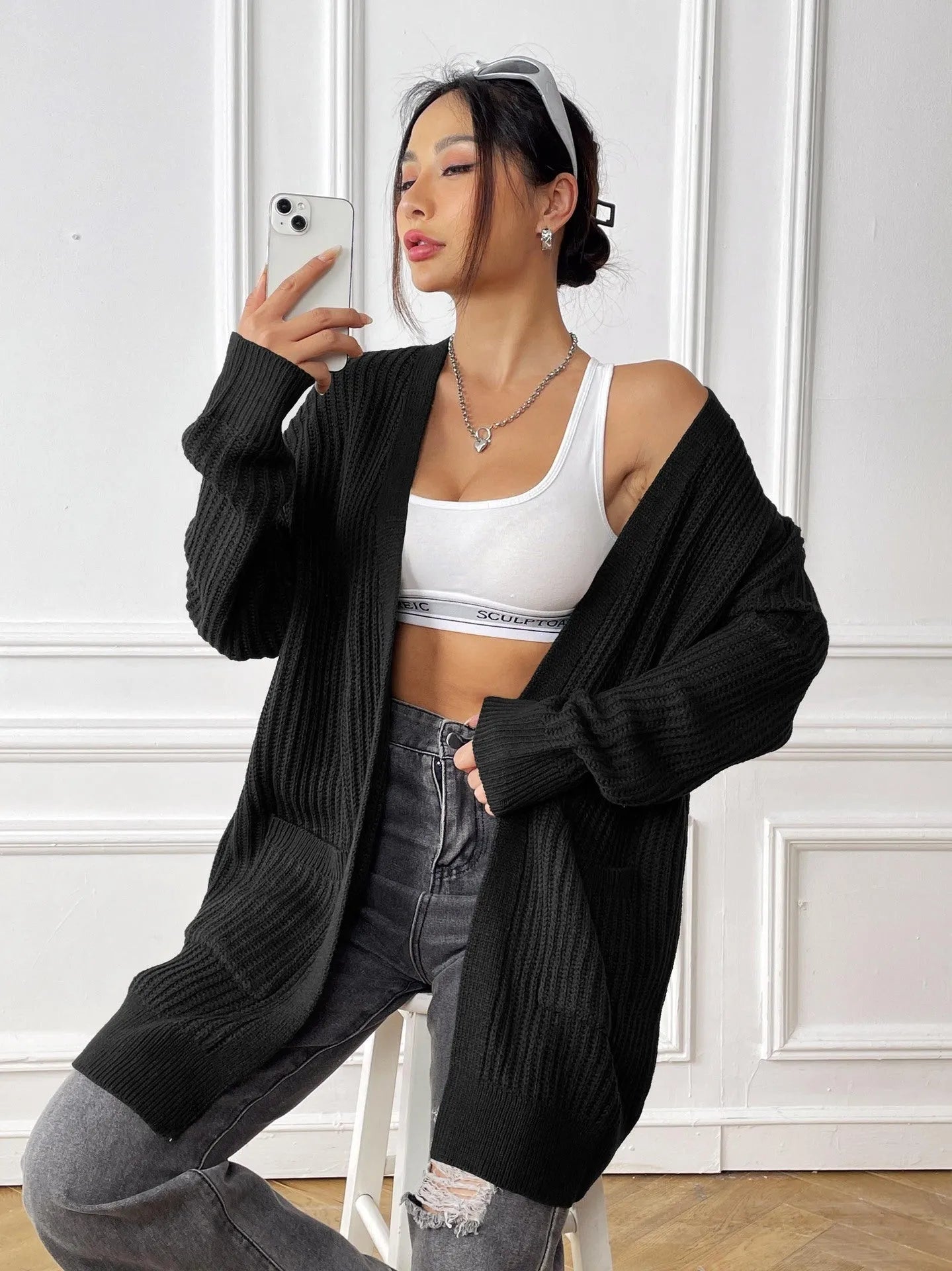 Women's dark green cardigan with two front pockets, 65cm length, loose fit design with long sleeves