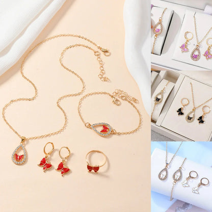 Elegant butterfly jewelry set including necklace, bracelet, and earrings with intricate design in various color options