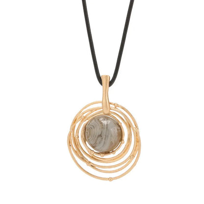 Gold geometric plaid pendant necklace on a textured snakeskin-style rope chain, laid out to show length.