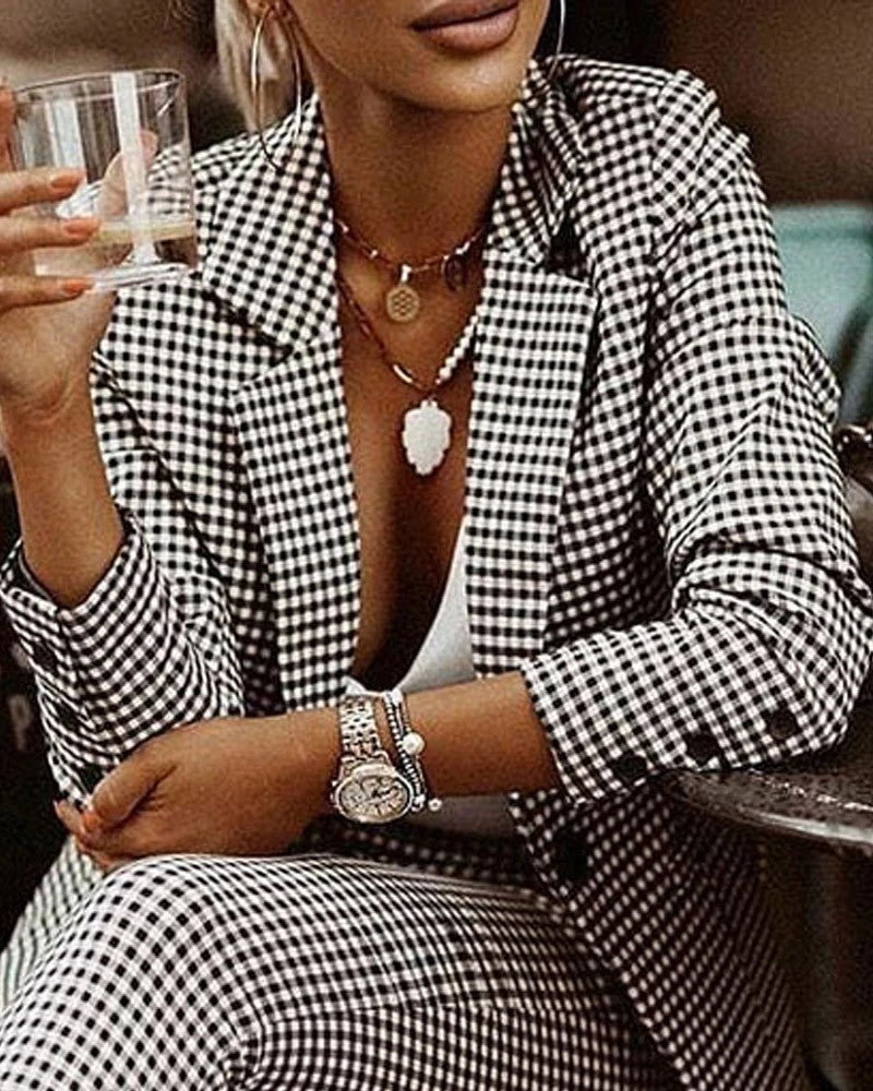 Women's plaid blazer and slim-fit pant set in black and white, and blue colors