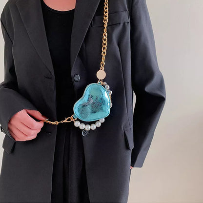 Mini heart-shaped pearls handbag in silver with adjustable chain strap