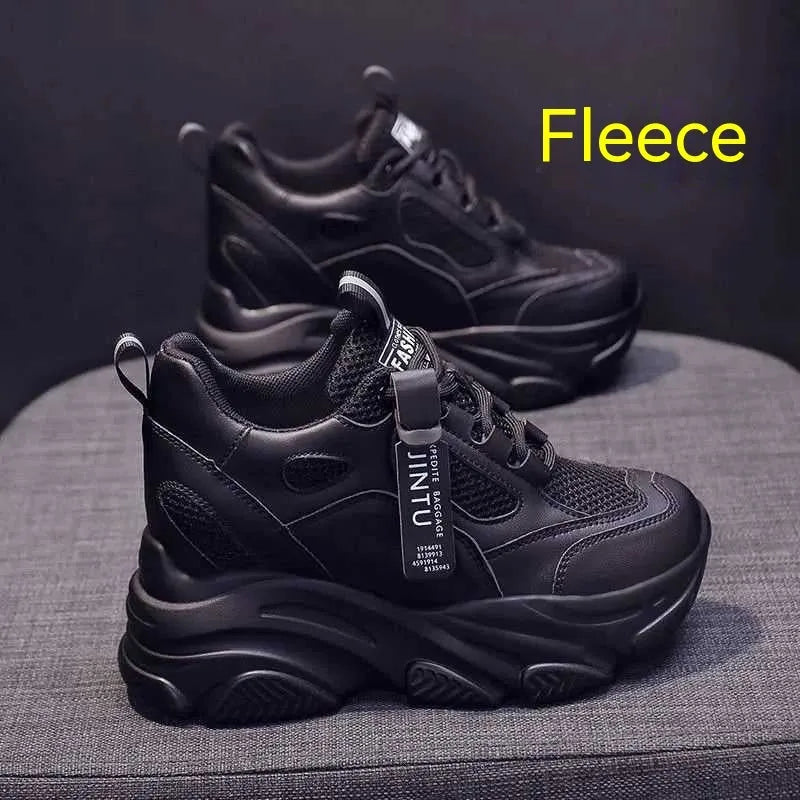 Women's black mesh platform casual shoes with hollow-out design detail on white background