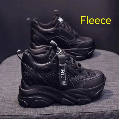 Women's black mesh platform casual shoes with hollow-out design detail on white background