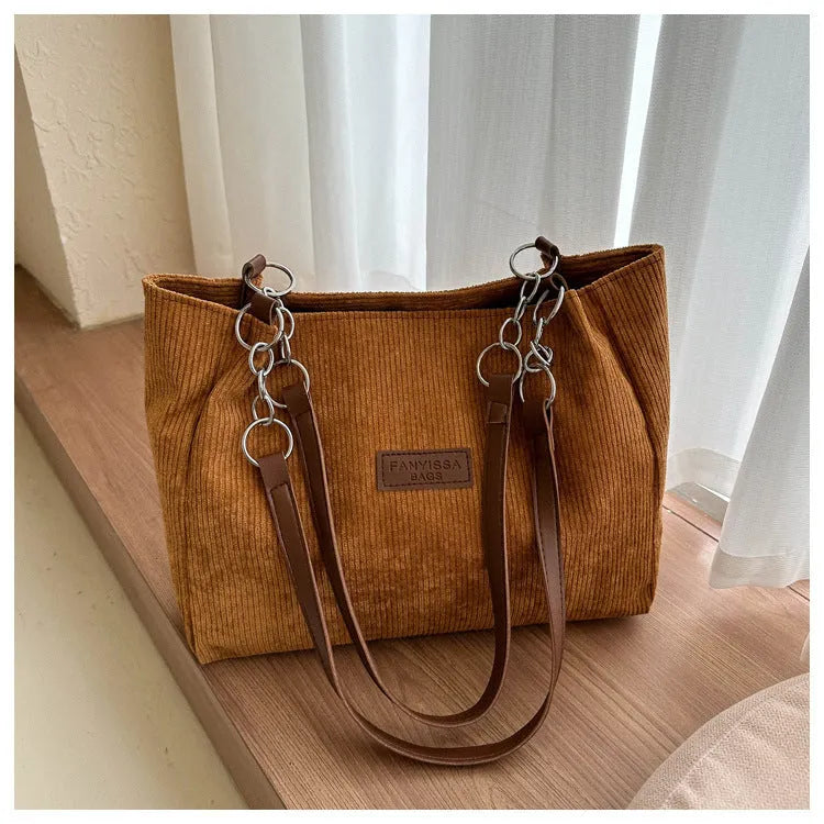 Corduroy one-shoulder tote handbag in horizontal square shape with three-dimensional pocket