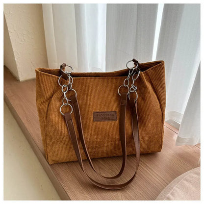 Corduroy one-shoulder tote handbag in horizontal square shape with three-dimensional pocket