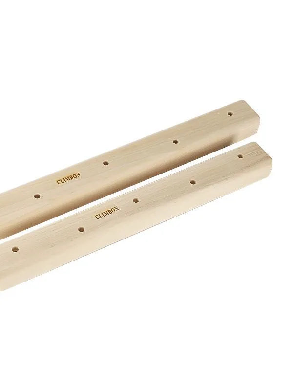 Three solid wood hangboards for grip strength training showing different edge depths and lengths