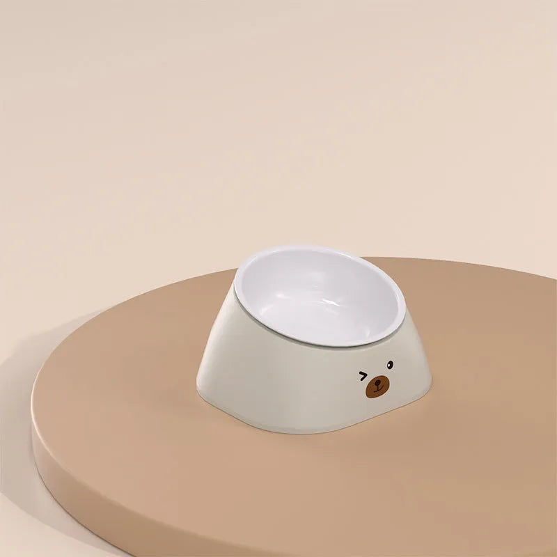Green tilted stainless steel pet bowl with a 15-degree angle on a white background.