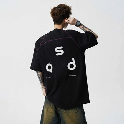 Black loose fit cotton T-shirt with white letter print on front, short sleeves and round neck.