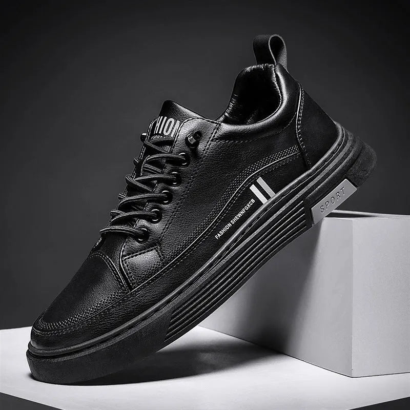 Men's low-top skateboard shoes with a rubber sole and elastic band closure, featuring a microfiber leather upper for casual wear and durability. Available in round-toe stitching styles in 2178 Black and 2178 White, in sizes 39 to 44.