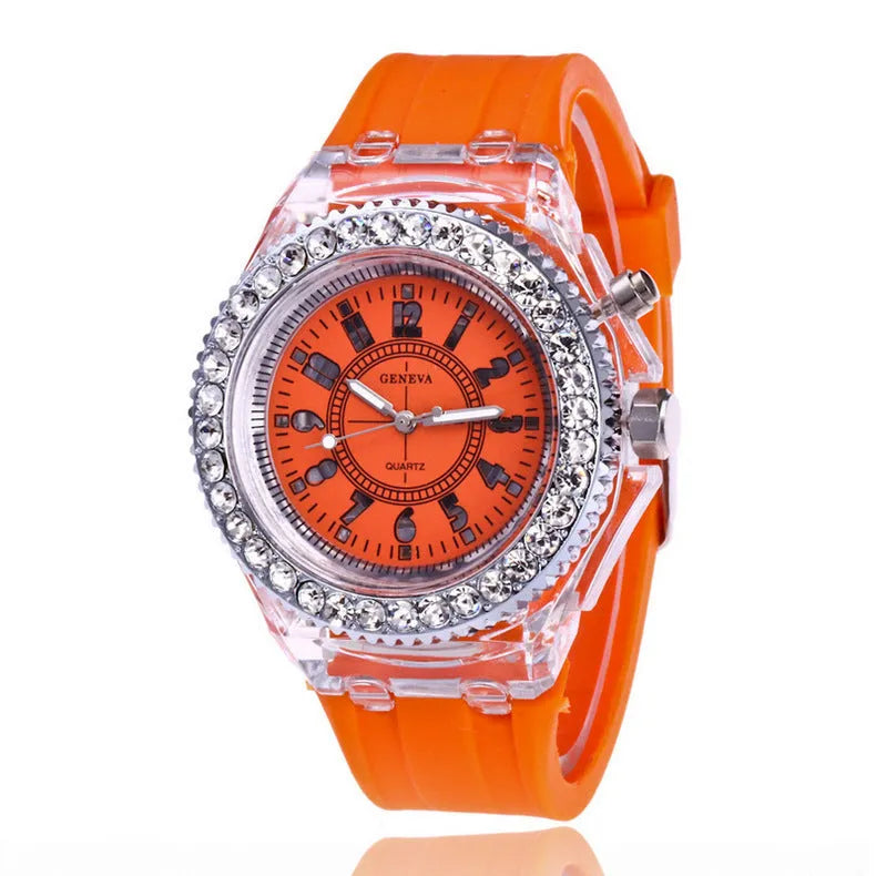 Women's LED luminous quartz watch with silicone strap and round alloy case on wrist