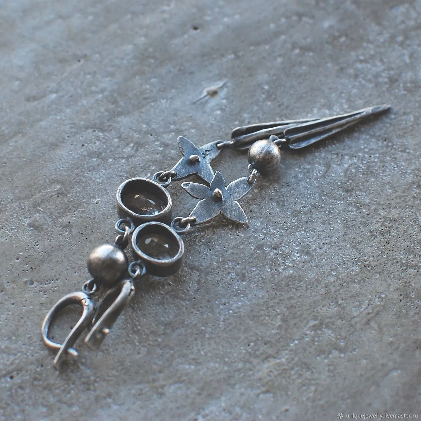 Pair of long antique silver geometric XINGX pendant earrings with rhinestone details on alloy posts.