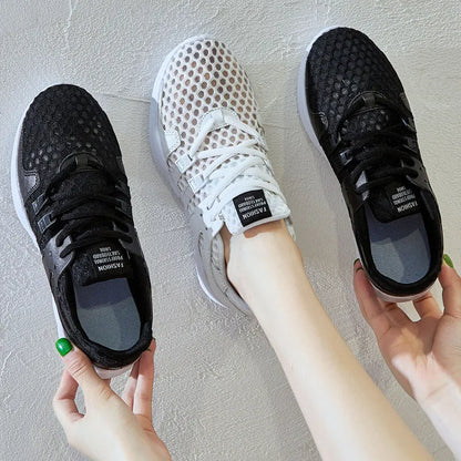 Low-top casual sneaker in mesh with hollow-out design and round toe.
