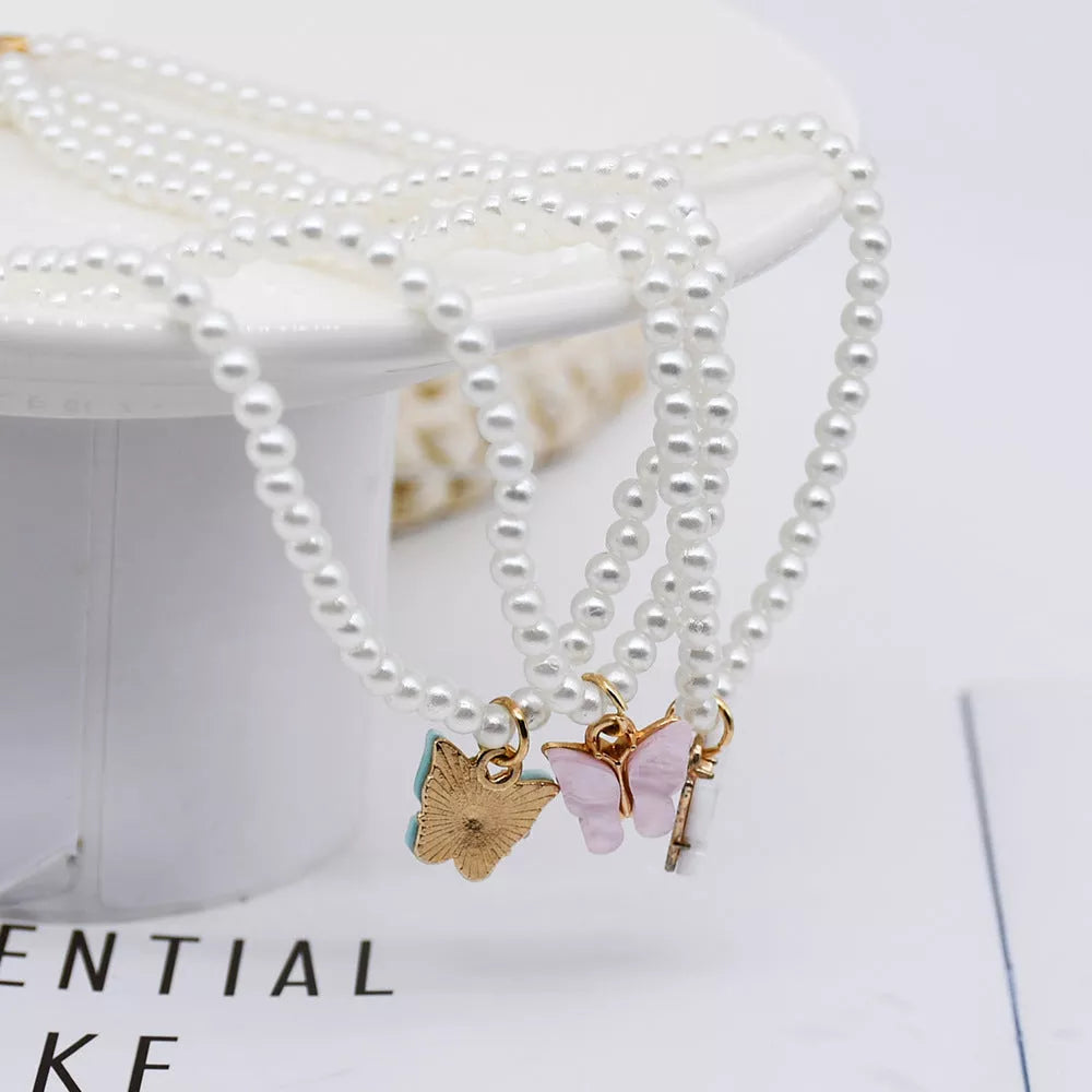 Elegant white pearl choker necklace with butterfly charm for women