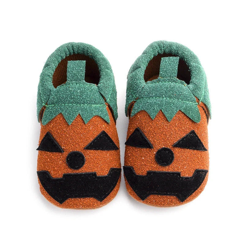 Adorable pumpkin-themed baby shoes with soft suede upper and non-slip canvas sole, available in vibrant yellow color and range of sizes