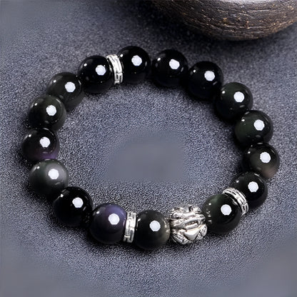 Silver 999 natural obsidian bracelet with cloud year design, shown in 10mm and 12mm unisex sizes.
