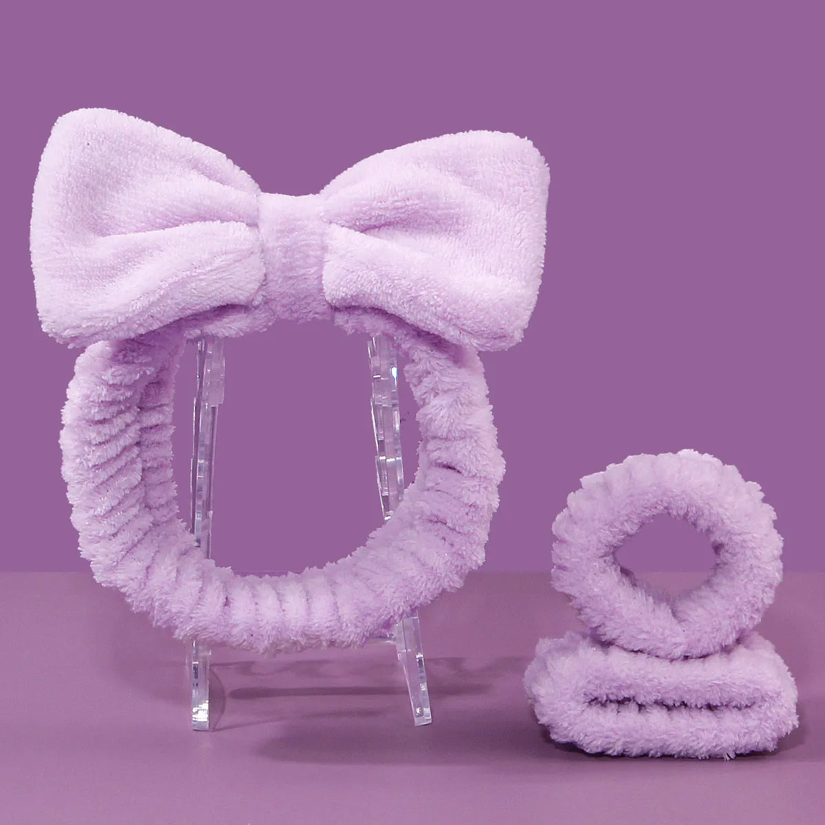 Facial brush set with coral fleece hair band and 4-count nylon brush heads in purple, gray, white, pink colours