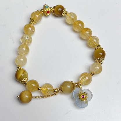 Citrine crystal bracelet with handmade flower tassel on wrist