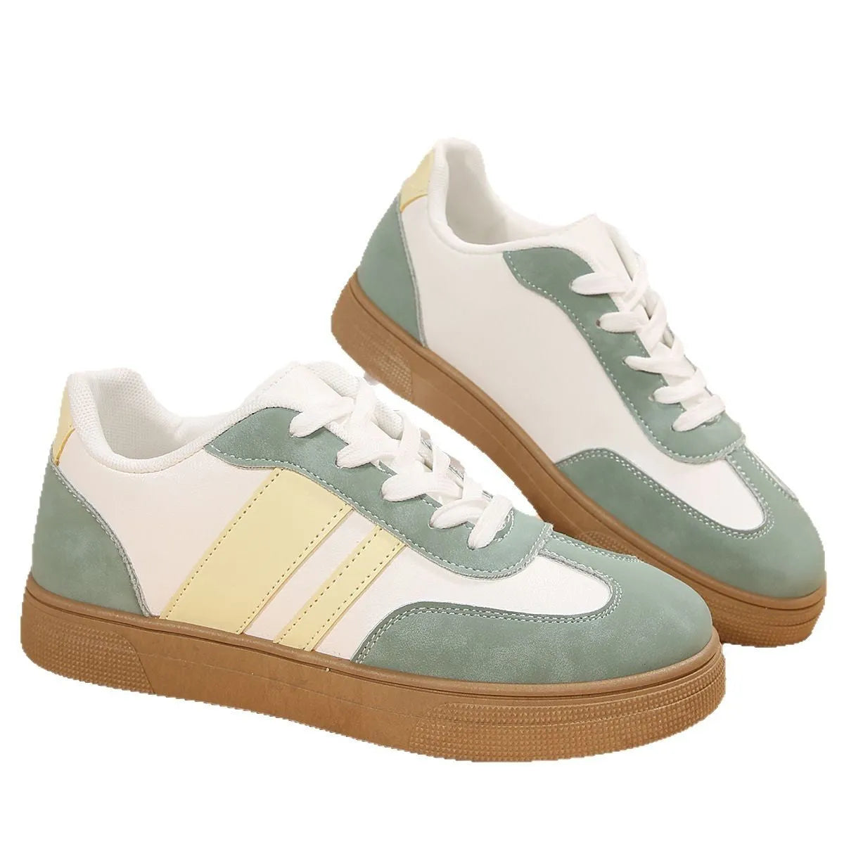 Green women's low-top retro sports shoes with cross-strap design and round toe.