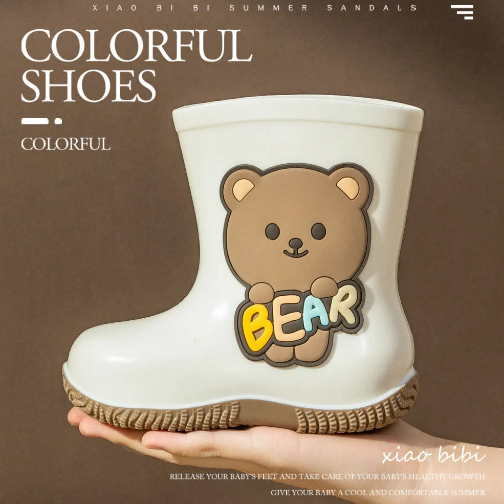Children's PVC rain shoes with cartoon bear design showing waterproof construction and low heel