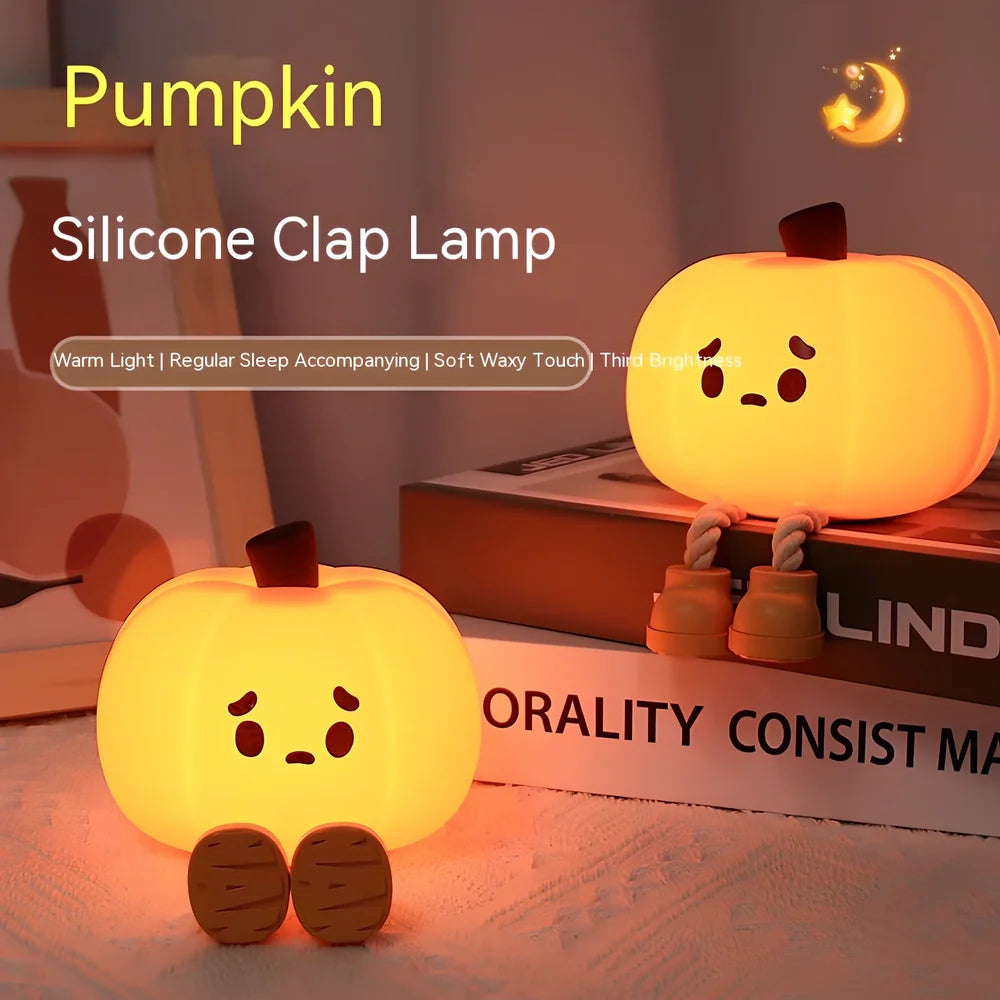 Orange silicone pumpkin night lamp measuring 98x105x83mm with built-in battery and USB charging port
