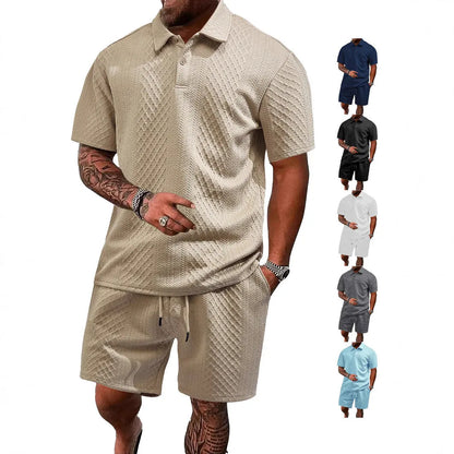 Men's patterned cloth casual suit set with short sleeve polo top and trousers on a hanger.