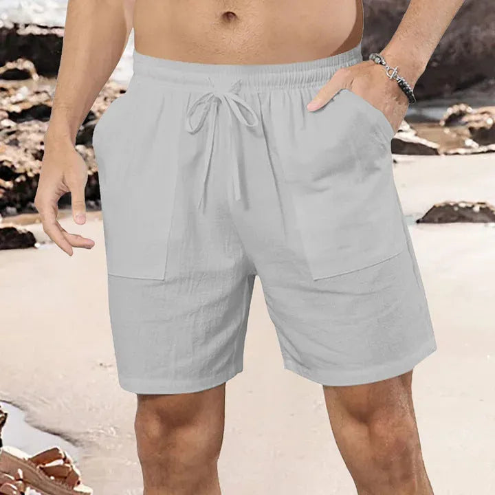Men's straight leg linen shorts in light blue on a plain background