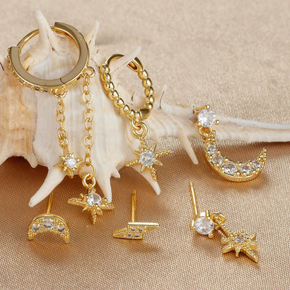 XINGX gold chain tassel earrings set showing six zircon stud earrings with dangling chain elements