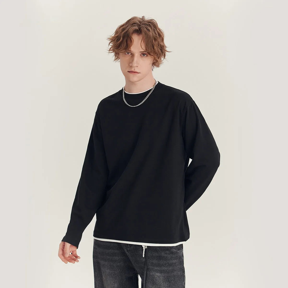 Men's loose fit long-sleeved cotton blend t-shirt in solid colour on hanger