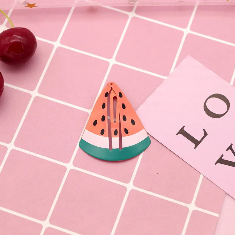 Colourful metal hair barrettes for children with printed watermelon, strawberry, pineapple and Christmas designs.