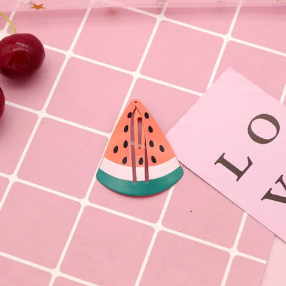 Colourful metal hair barrettes for children with printed watermelon, strawberry, pineapple and Christmas designs.