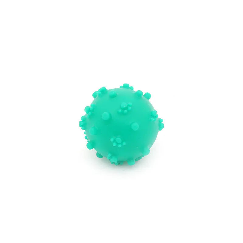 Four colourful spiky dog balls with paw print dimples, measuring 2 inches diameter for small breed dogs