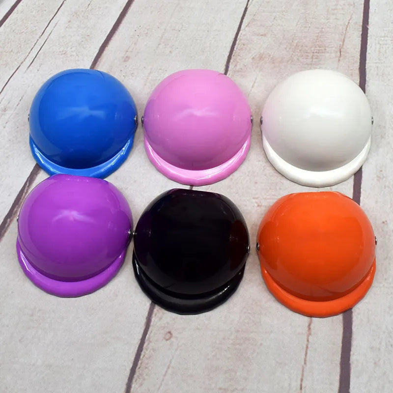 Plastic dog motorcycle cap helmet in seven colour options showing three diameter sizes