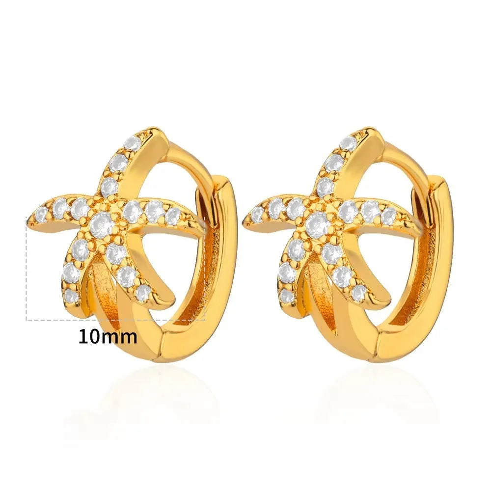 Women's irregular geometric butterfly earrings in copper with diamond treatment, showing heart-shaped and star designs in various colours