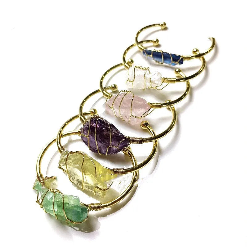 Unshaped natural crystal rough stone bracelet with gold winding metal accents in geometric design