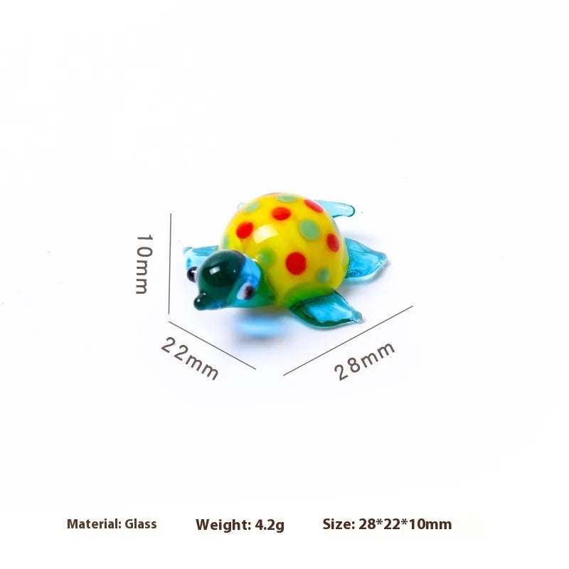 Geometric glass turtle figurine ornament on a desk, shown in blue head and blue shell colour variant.