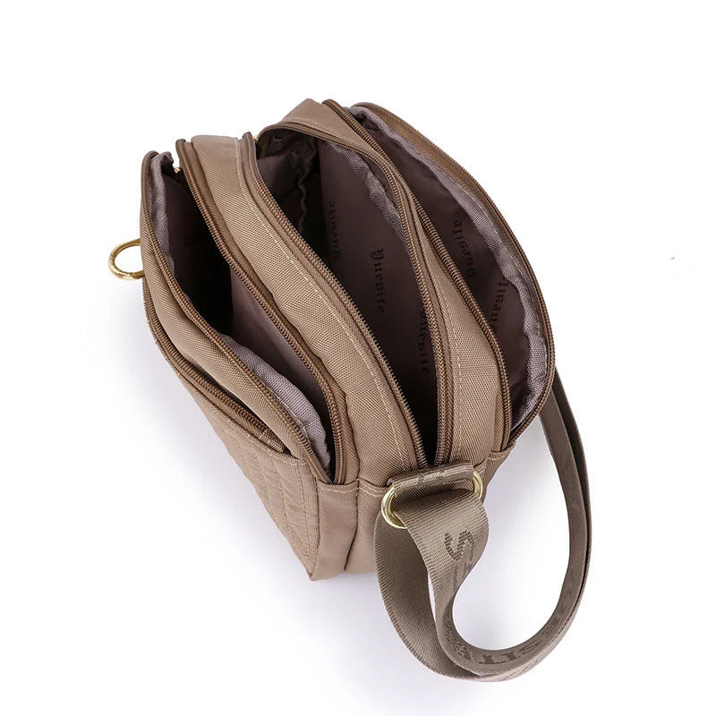 Casual women's crossbody messenger bag in nylon with polyester lining, available in multiple colors