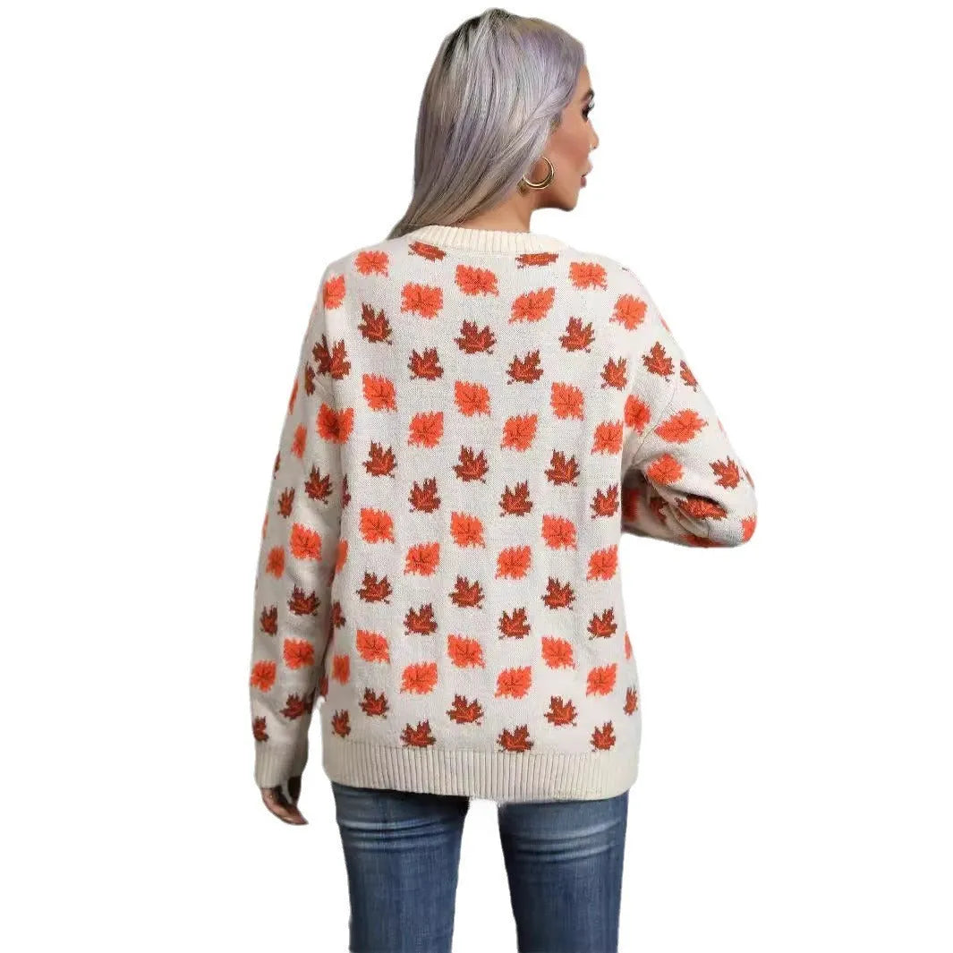 Beige and dark green Christmas sweater with maple leaf design, round neck, and loose fit