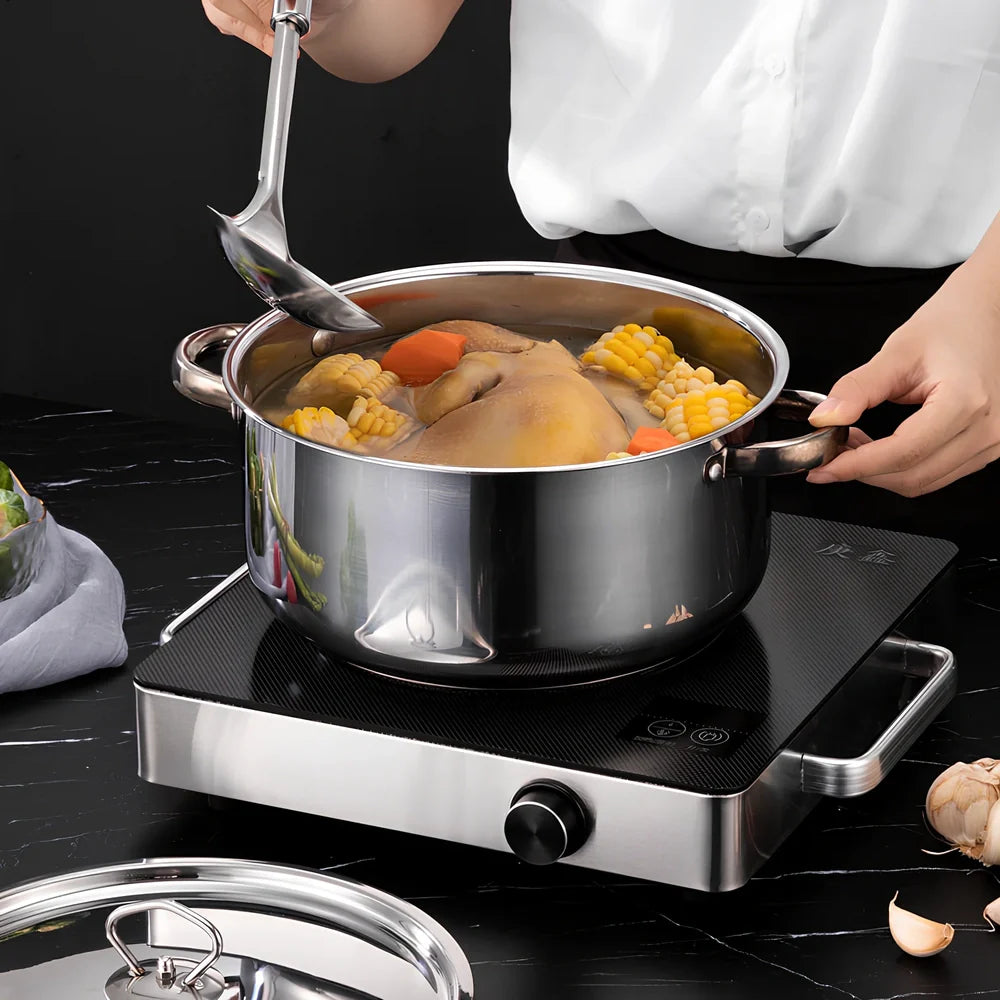 Stainless steel cookware set with 12 pots, glass lids, and utensils in compact 45cm storage package