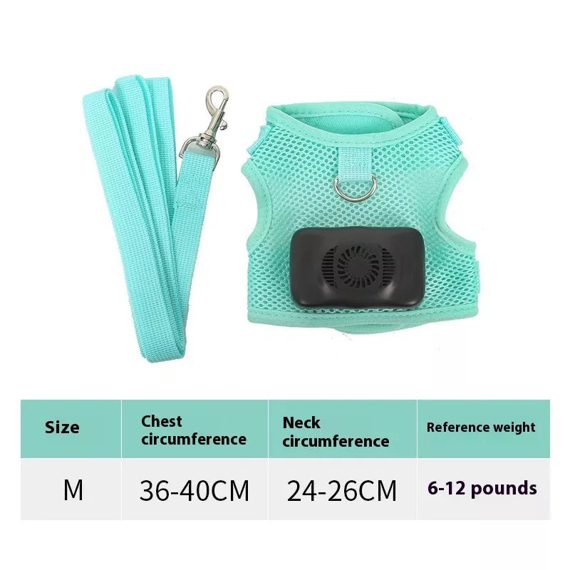 Small dog wearing mint green cooling vest harness with air conditioner