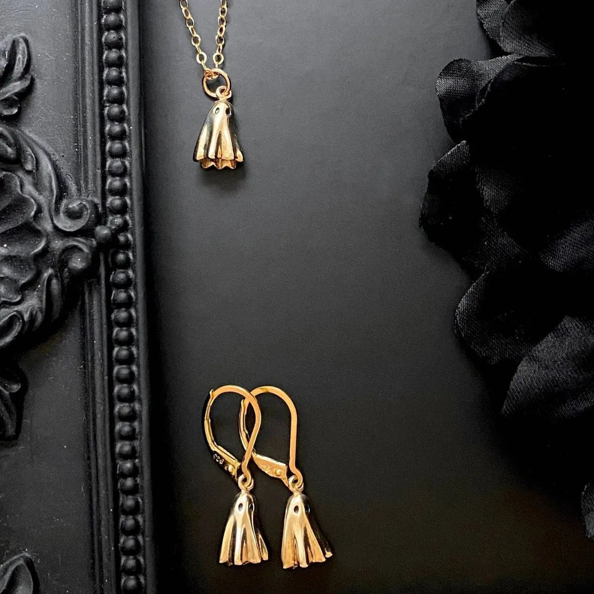 Titanium steel ghost pendant necklace on a 45cm stainless steel chain with electroplated finish, available in cable, figaro, or mini staple styles.