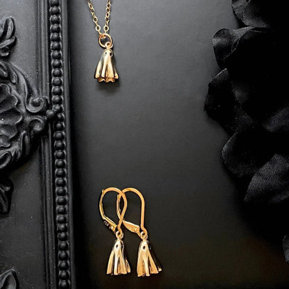 Titanium steel ghost pendant necklace on a 45cm stainless steel chain with electroplated finish, available in cable, figaro, or mini staple styles.