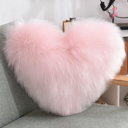 Cozy heart-shaped plush throw pillows in various colors and sizes for living room and bedroom decor