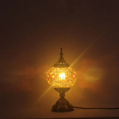 Glass table lamp with 150mm diameter shade and 330cm cord on wooden surface