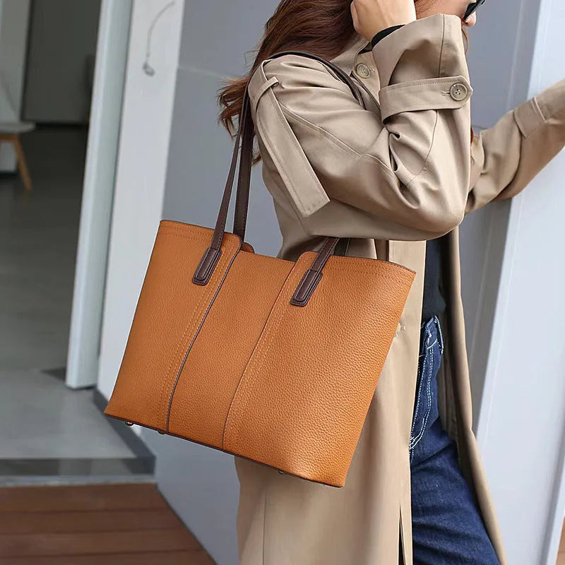 Women's genuine leather large capacity crossbody commuter bag in black, shown with internal organised compartments.